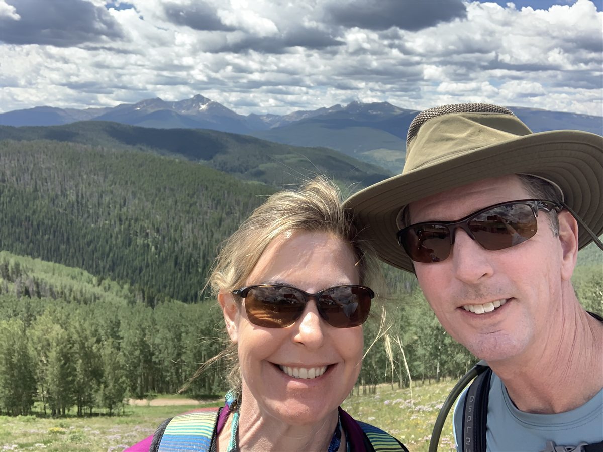 Drs. Lori and Chris King hiking in the mountains